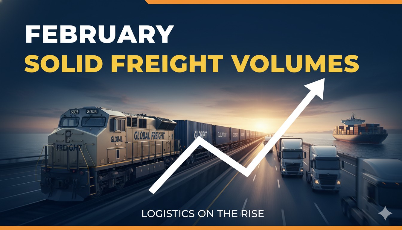US freight train loaded with containers and rail cars moving through industrial landscape representing solid February 2026 volumes